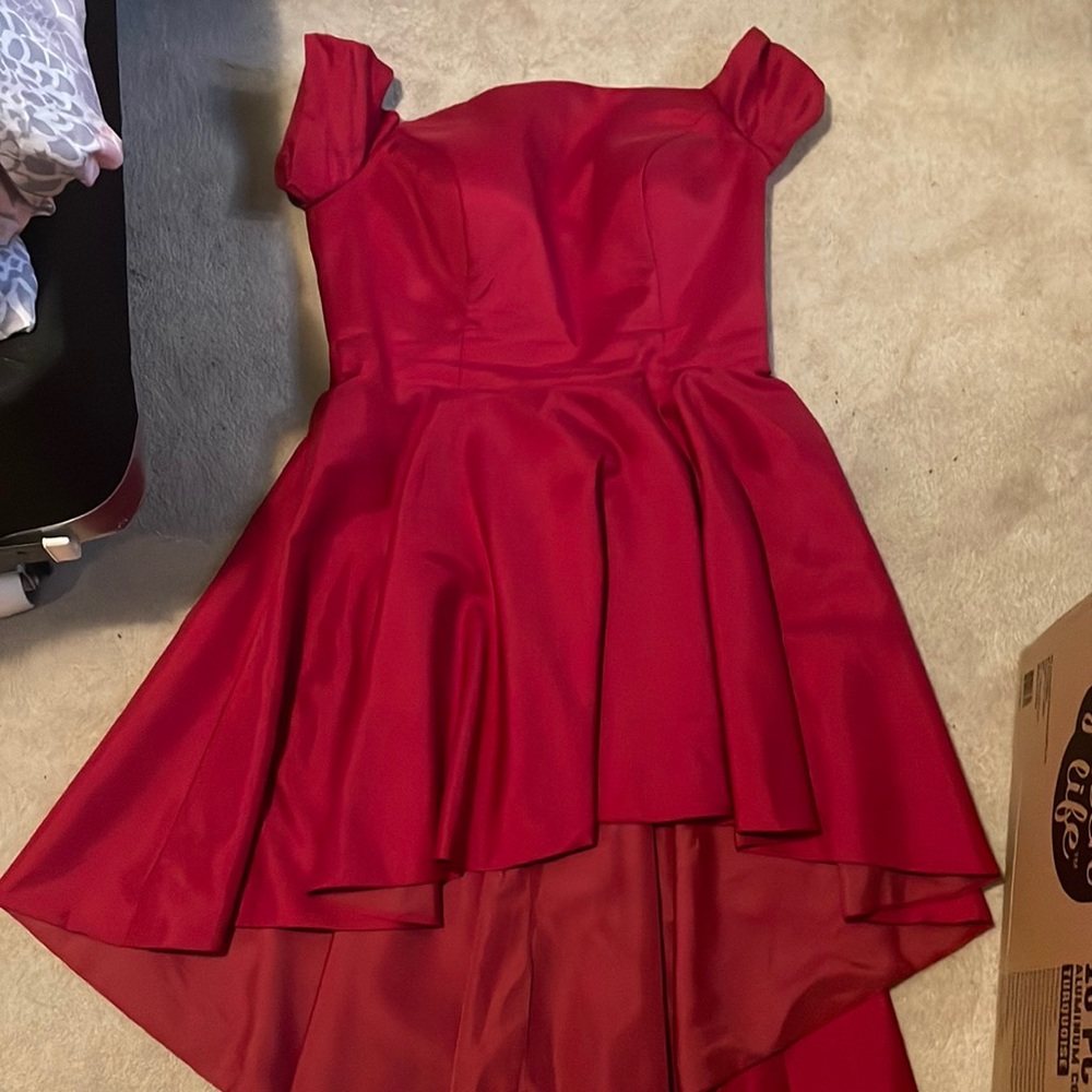 High Low red dress. Corset style top. Unknown brand and size. Fits size 15/16